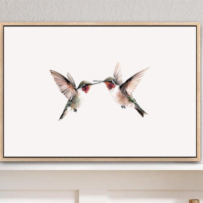 a framed painting of two hummingbirds in mid-flight, with their beaks touching, against a white background. Hummingbirds Art Print, Vintage Framed Artwork, Ruby Throated Sage Green Watercolor Canvas, Minimalist Farmhouse, 2 Birds in Flight