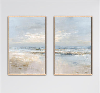two identical paintings of a serene beach scene, featuring a calm ocean and a cloudy sky.