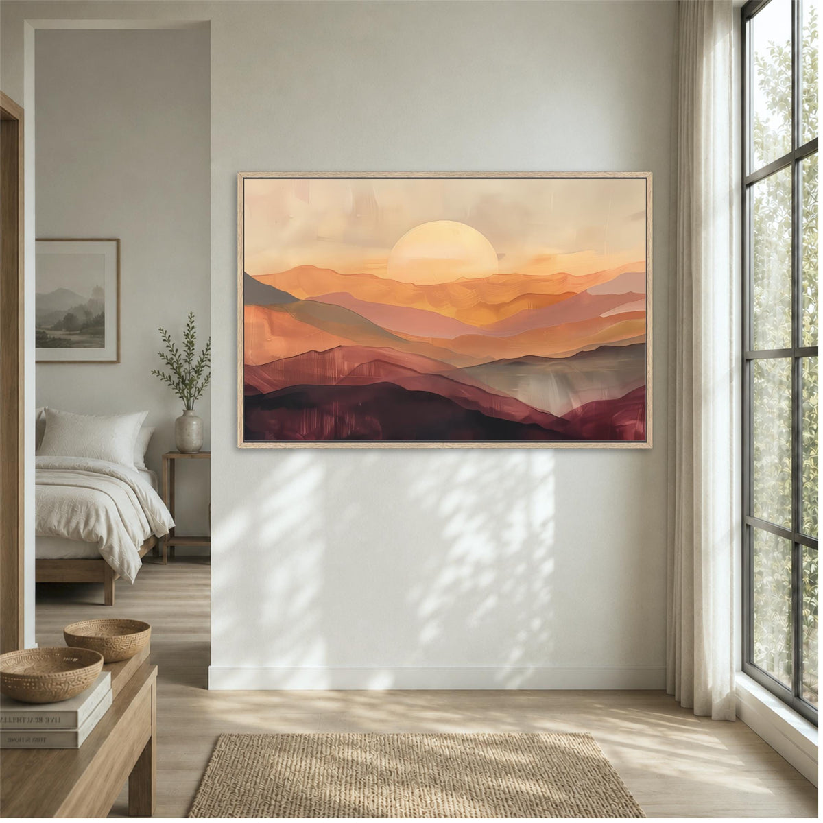 a large, framed painting of a sunset over mountains hanging on a wall in a bedroom.