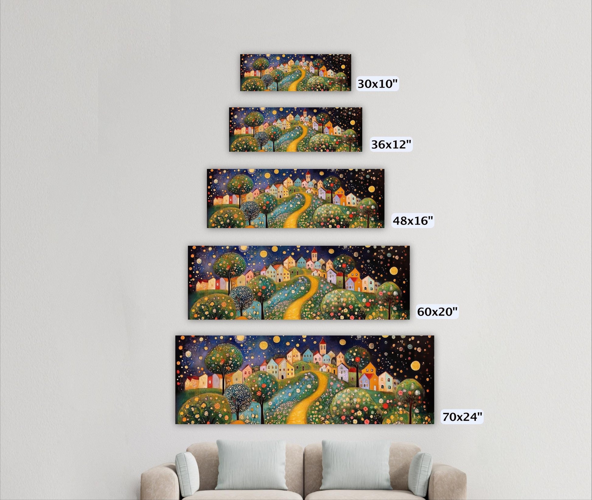a living room with a couch and three paintings on the wall