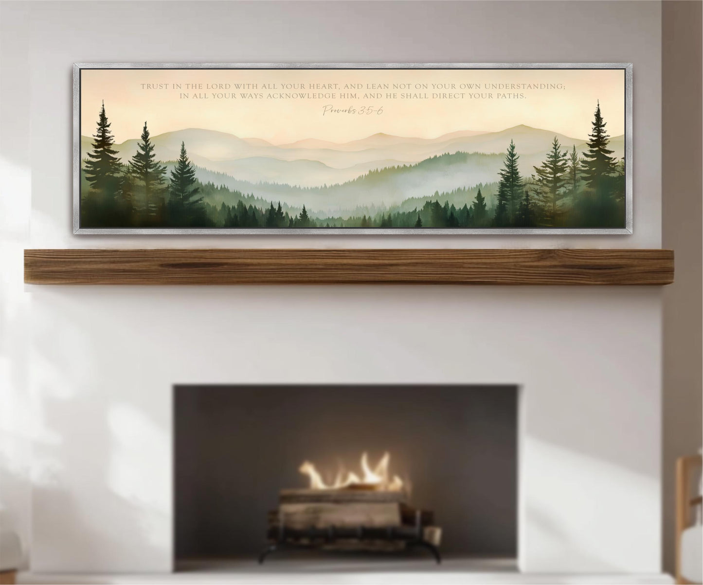 a fireplace with a warm fire burning inside, surrounded by a serene landscape of mountains and pine trees. Above the fireplace, there is a framed quote from the Bible, specifically Proverbs 22:6, which reads "Trust in the LORD with all your heart, and lean not on your own understanding. In all your ways acknowledge Him, and he shall direct your path."