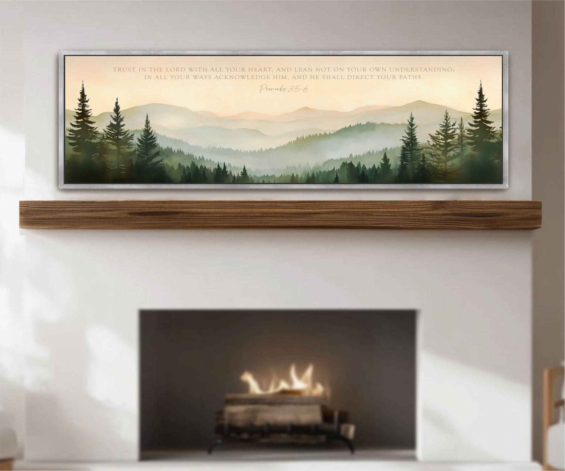 a fireplace with a warm fire burning inside, surrounded by a serene landscape of mountains and pine trees. Above the fireplace, there is a framed quote from the Bible, specifically Proverbs 22:6, which reads "Trust in the LORD with all your heart, and lean not on your own understanding. In all your ways acknowledge Him, and he shall direct your path."