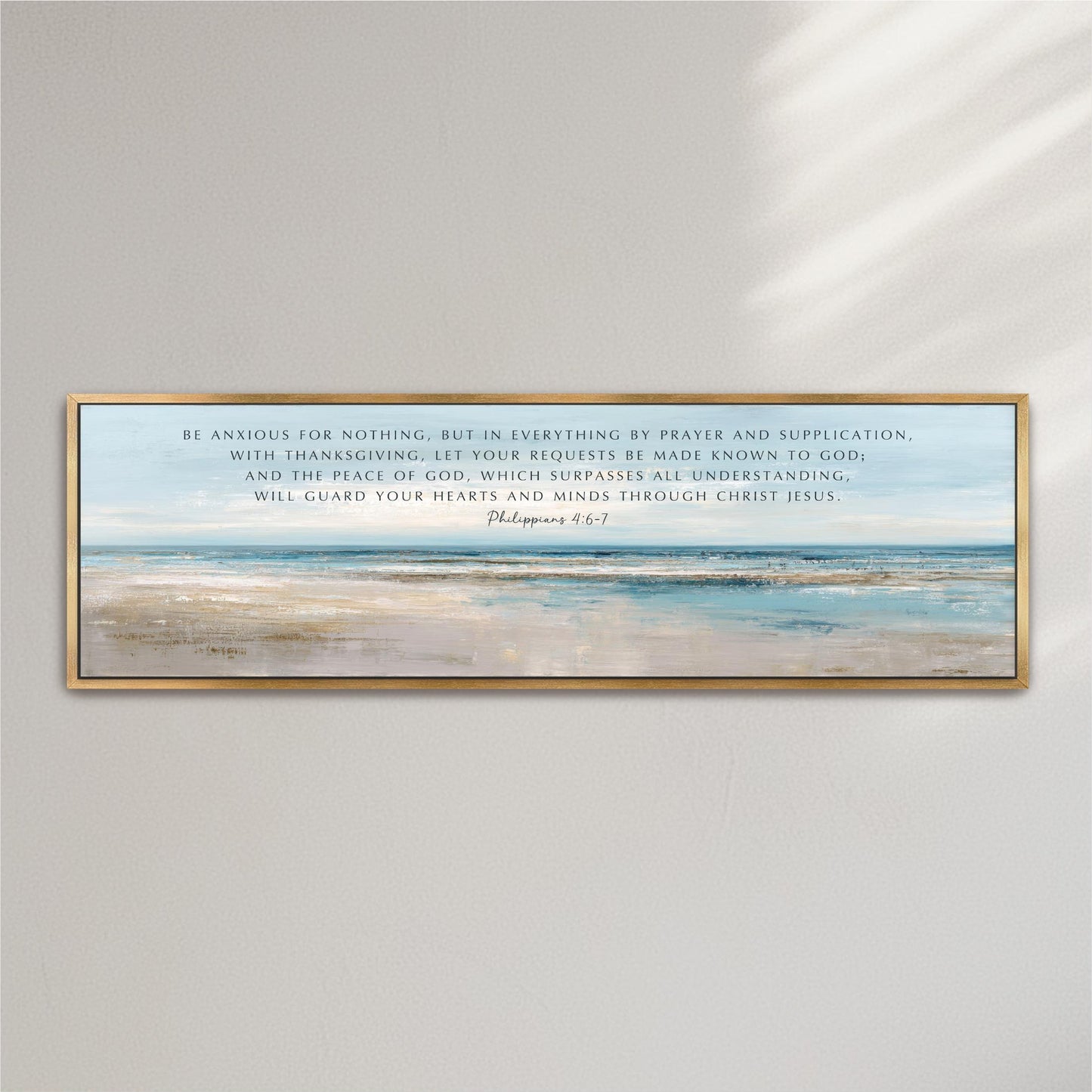The image is a framed print of a serene landscape with a body of water and a sky background. The text on the print is a biblical quote from the book of Philippians 4:1, which encourages prayer and supplication as a means to be known to God and to have the peace of God.