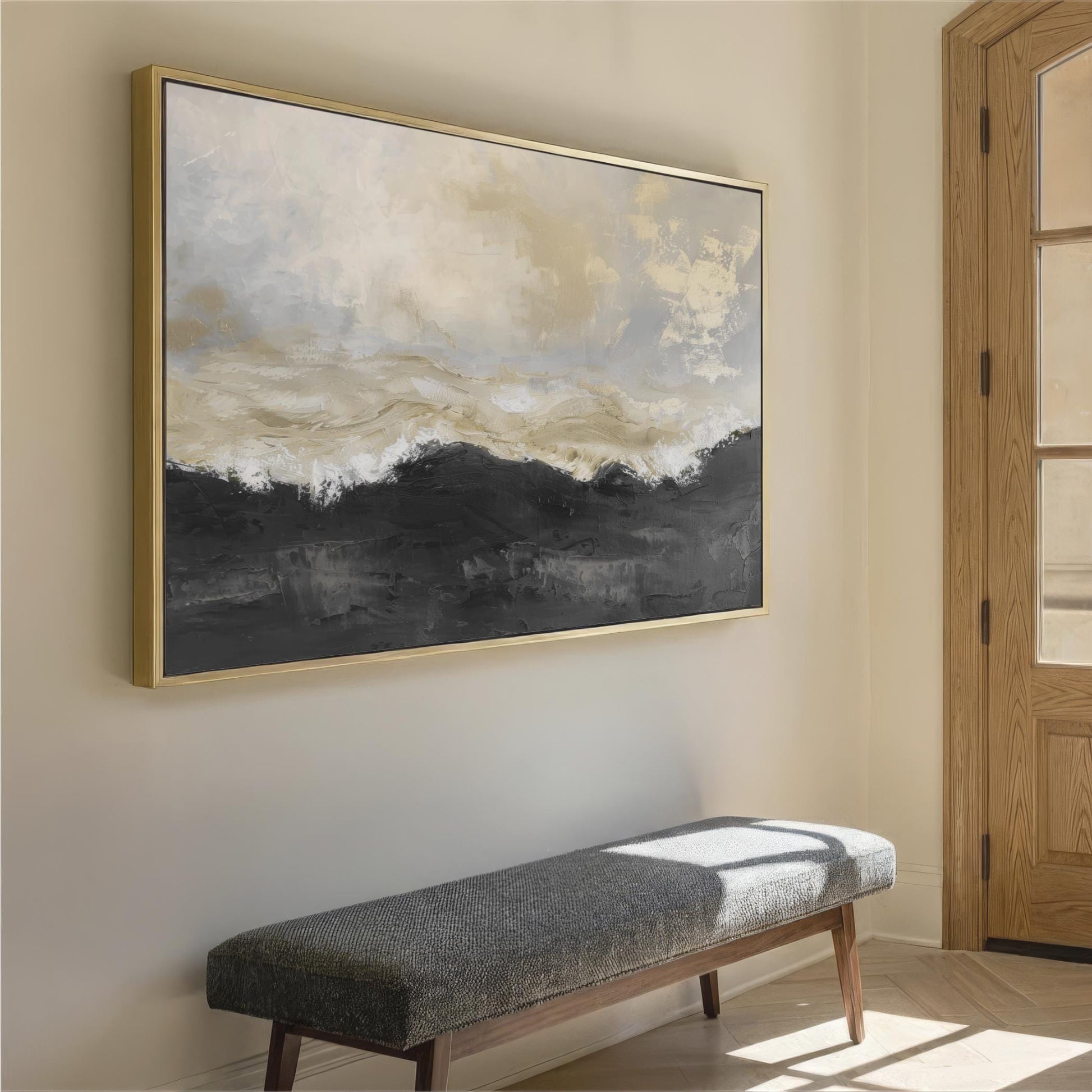 a large abstract painting hanging on a wall, with a wooden bench placed in front of it.
