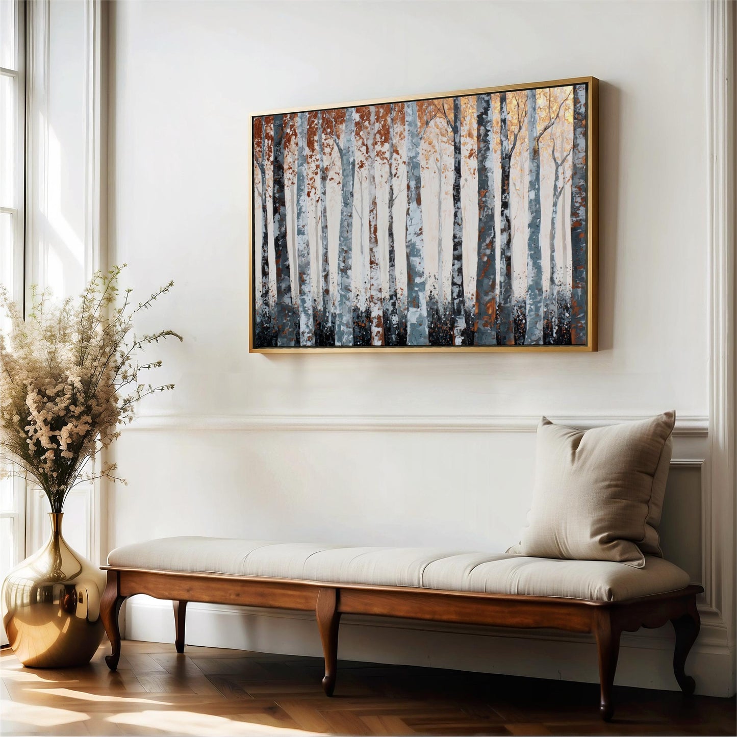 a wooden bench with a beige cushion, positioned in front of a large painting of trees on a white wall.