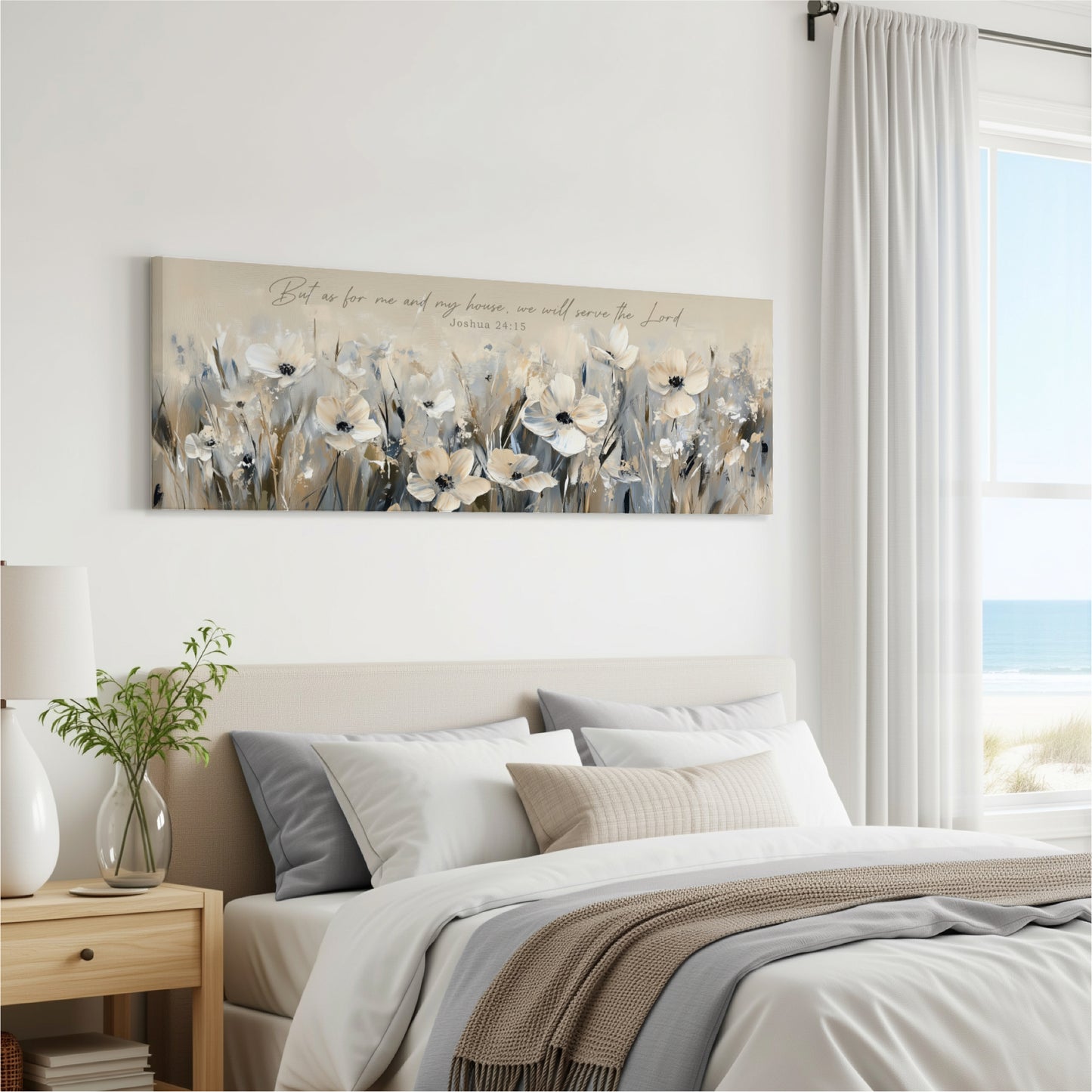 A bedroom with a large bed, a nightstand, and a painting of flowers hanging on the wall.