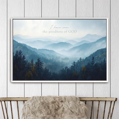 The image is a framed landscape photograph depicting a mountainous, forested scene with a misty, hazy atmosphere.