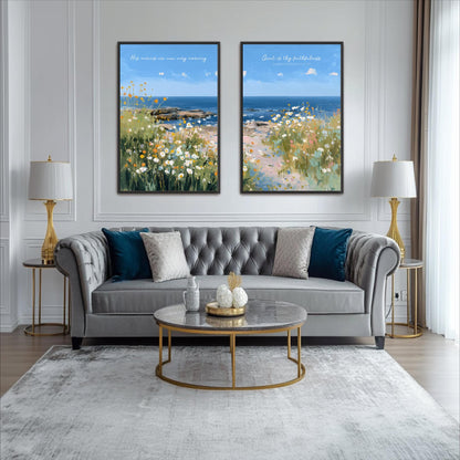 a living room with a gray tufted sofa, a round glass coffee table, and two framed paintings of a beach scene with flowers. The paintings are hung on the wall above the sofa, creating a harmonious and visually appealing space.