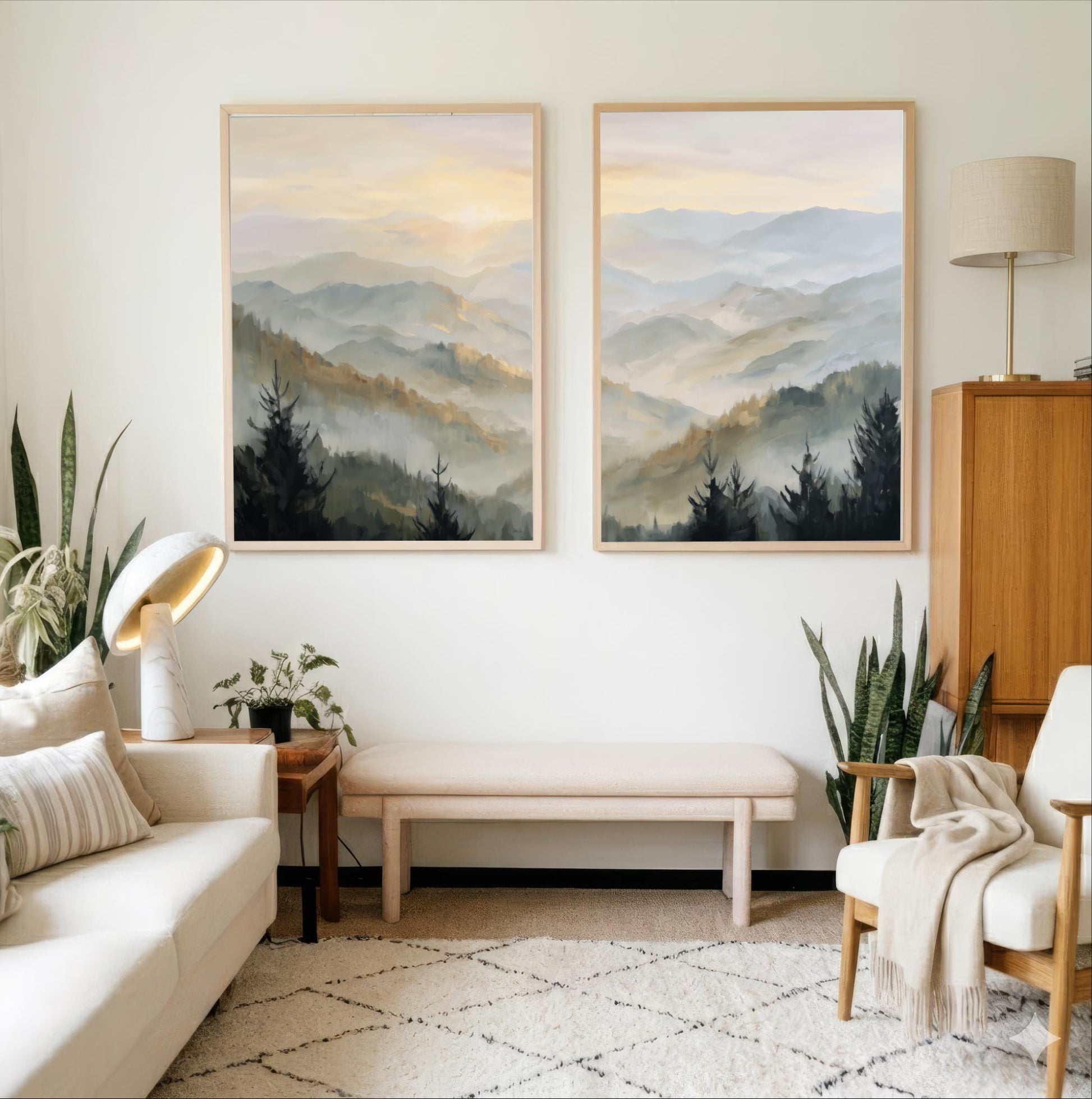 a cozy living room with two large landscape paintings hanging on the wall, depicting a serene mountain scene. The room is furnished with a white sofa, a wooden side table, and a wooden cabinet. The room is decorated with various plants and a rug, creating a warm and inviting atmosphere.