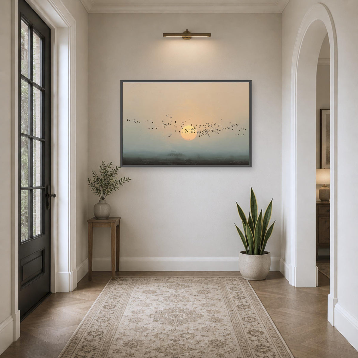 a serene and well-lit hallway with a large painting of a sunrise or sunset on the wall, a small table with a plant, and a rug on the floor.