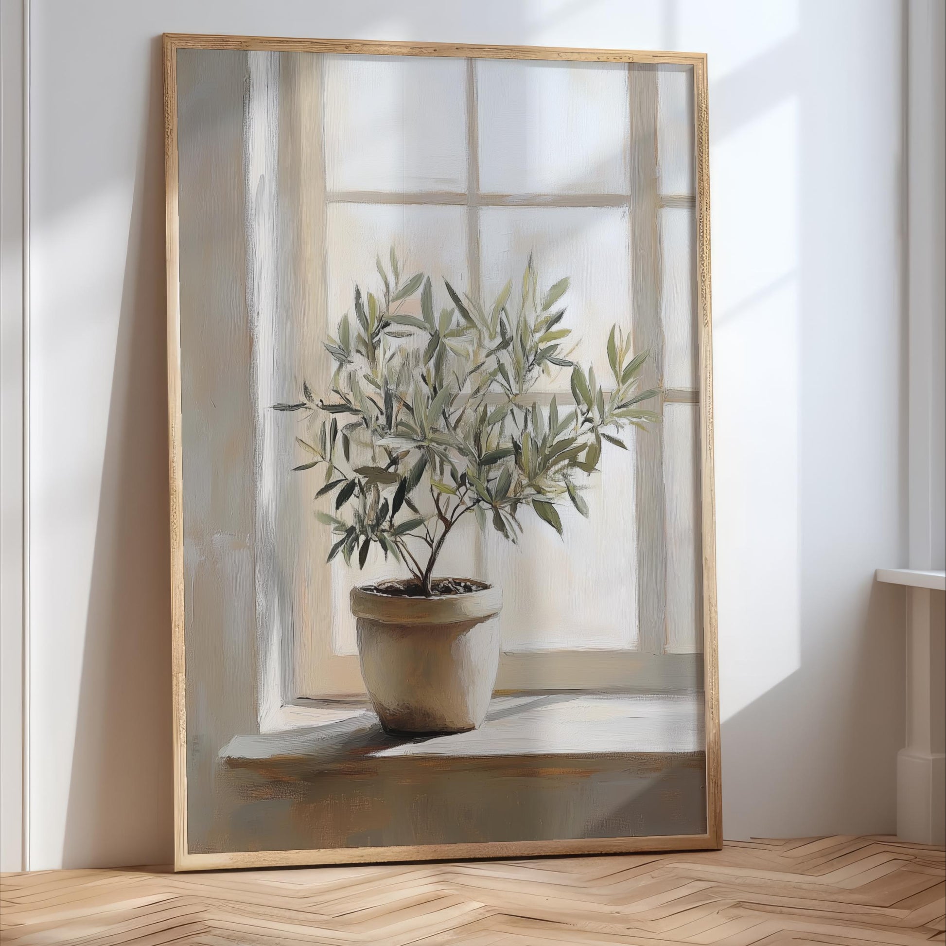 A large painting of a potted olive tree with green leaves, placed on a wooden floor in front of a window.