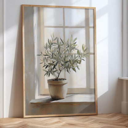 A large painting of a potted olive tree with green leaves, placed on a wooden floor in front of a window.