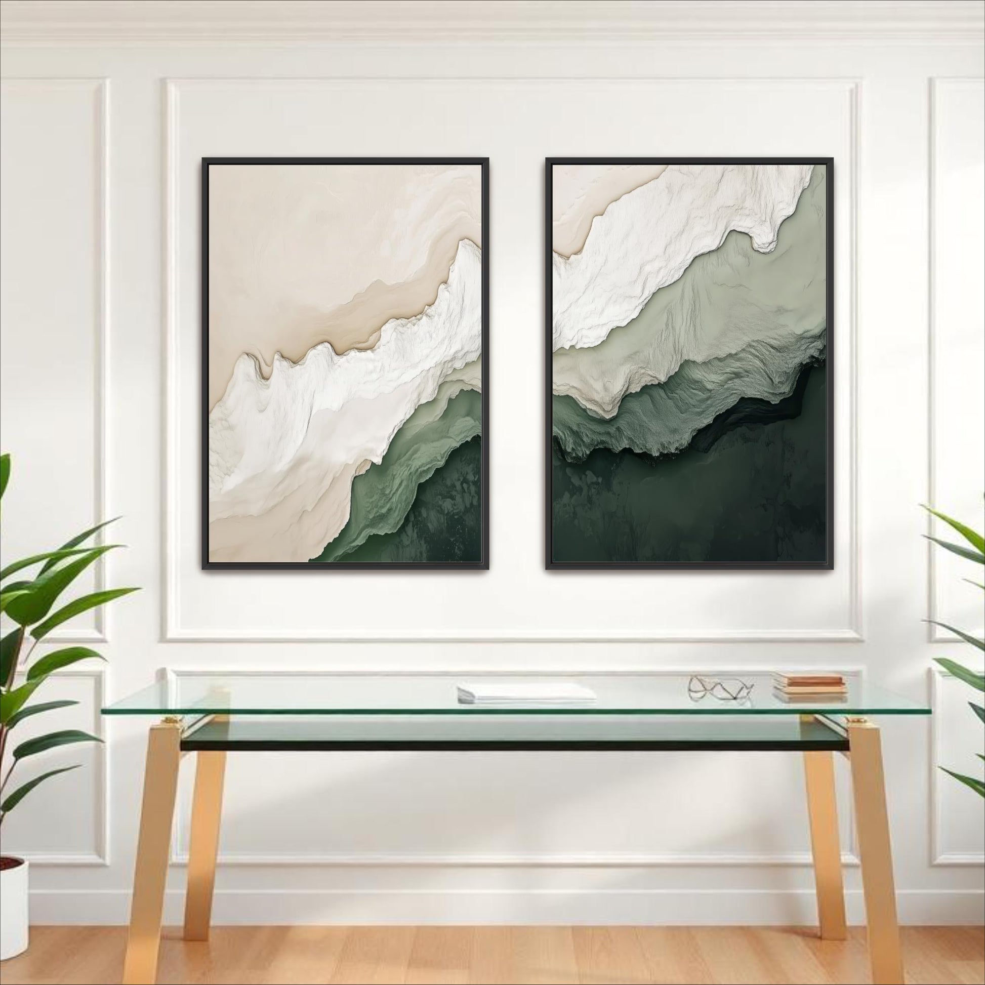 two abstract paintings hanging on a white wall above a glass desk with a wooden frame.