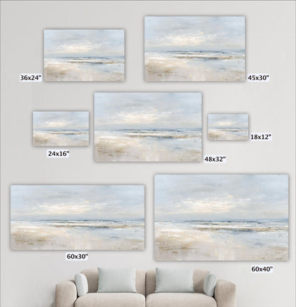 a collection of seven landscape paintings, each with a different size, displayed on a wall. The paintings depict various scenes of a beach or ocean landscape, with varying sizes and dimensions. In the foreground, there is a couch or sofa, providing a seating area for viewers to appreciate the artwork.