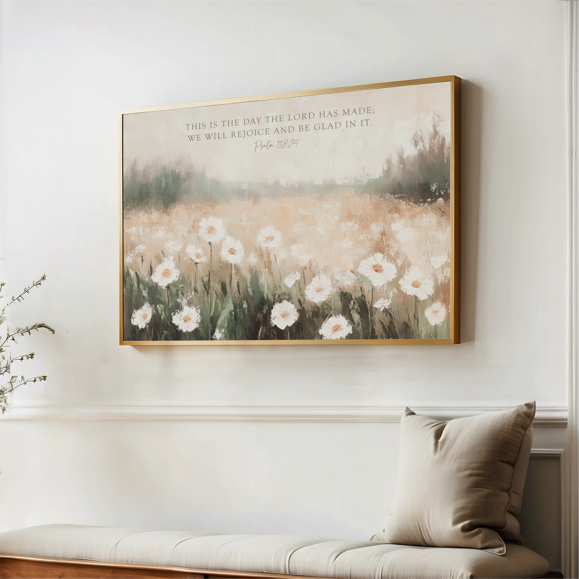 a painting of a field of white flowers hanging on a wall, with a quote from the Bible above it.