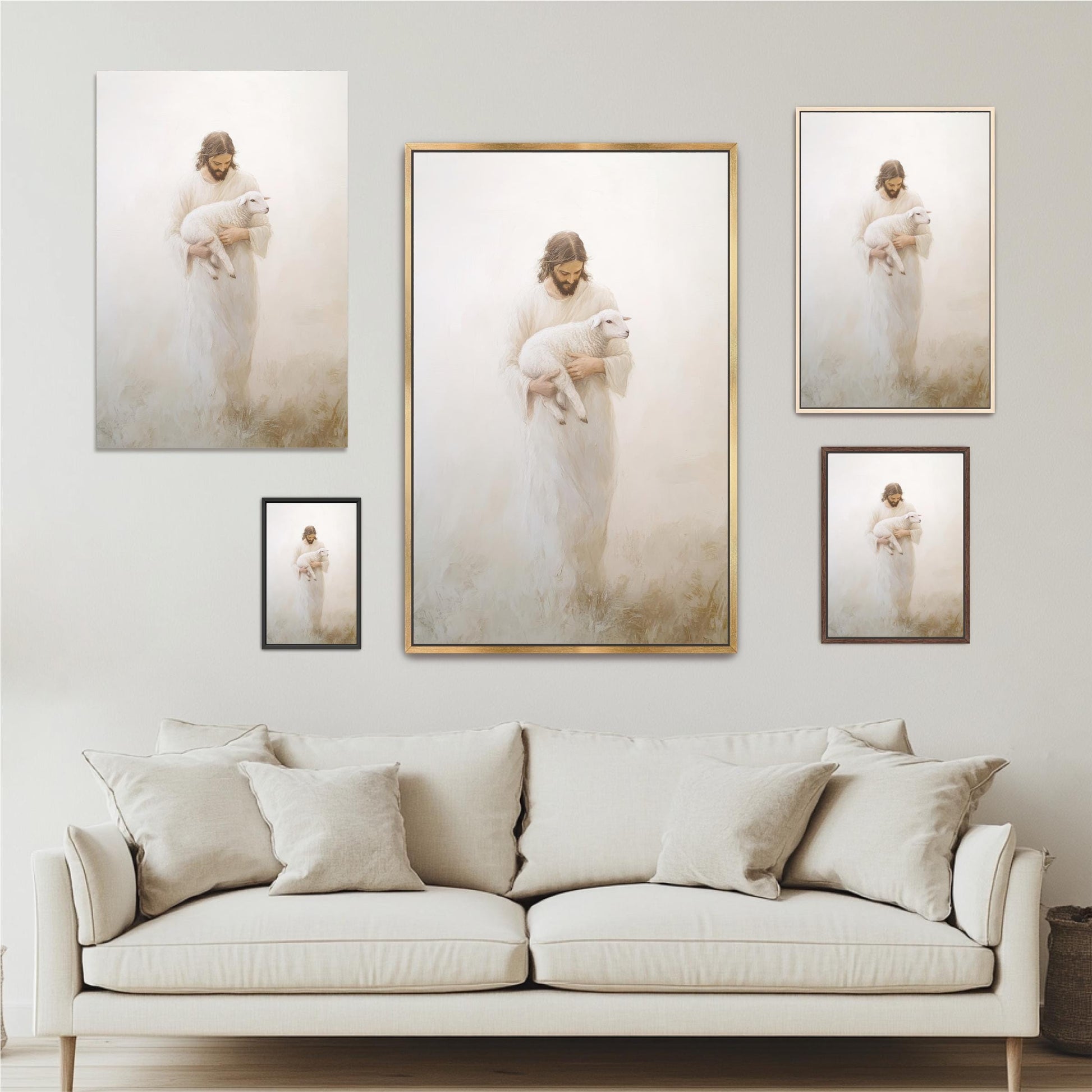 a large framed painting of a woman holding a lamb, with a smaller framed painting of the same woman below it. The painting is set against a white wall, and there is a white sofa in the foreground.