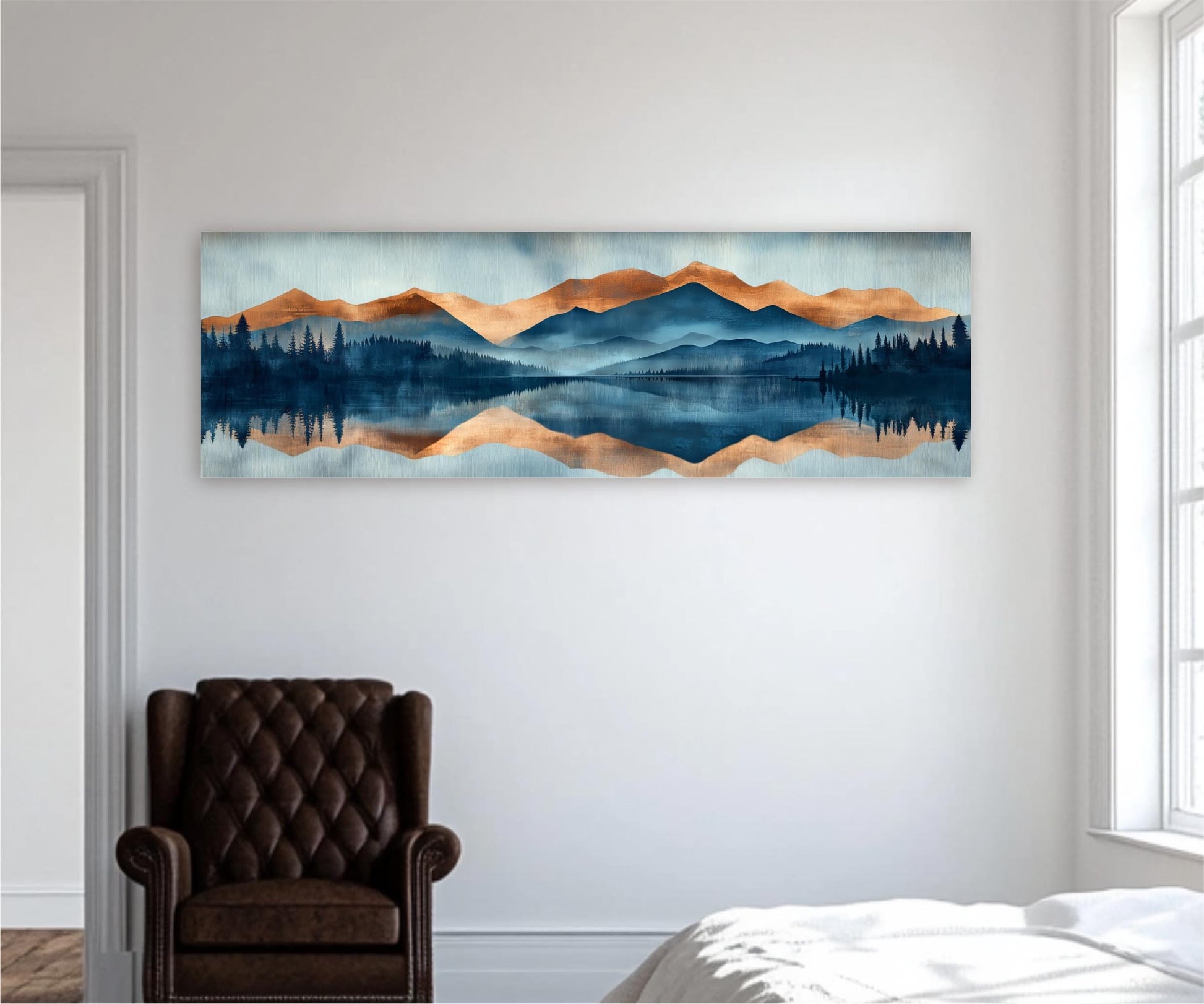 a large landscape painting hanging on a white wall, depicting a serene mountain range reflected in a calm lake. In the foreground, there is a brown leather armchair, and a white bed can be seen in the background.