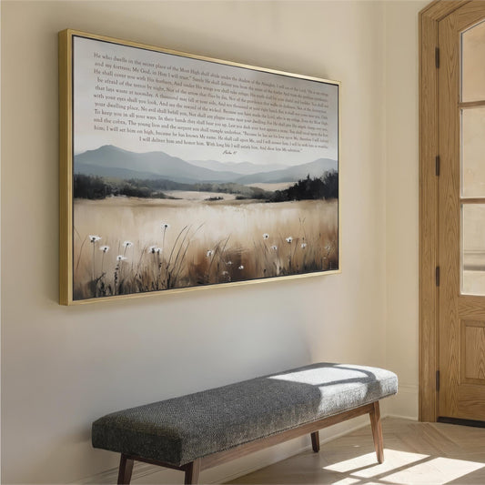 a large framed painting of a serene landscape with a field of tall grass and a body of water in the background, hanging on a wall above a gray bench.