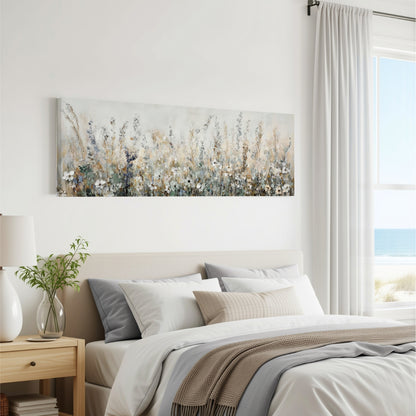 a serene bedroom scene with a large painting of a field of flowers hanging on the wall above a bed with white and gray bedding.