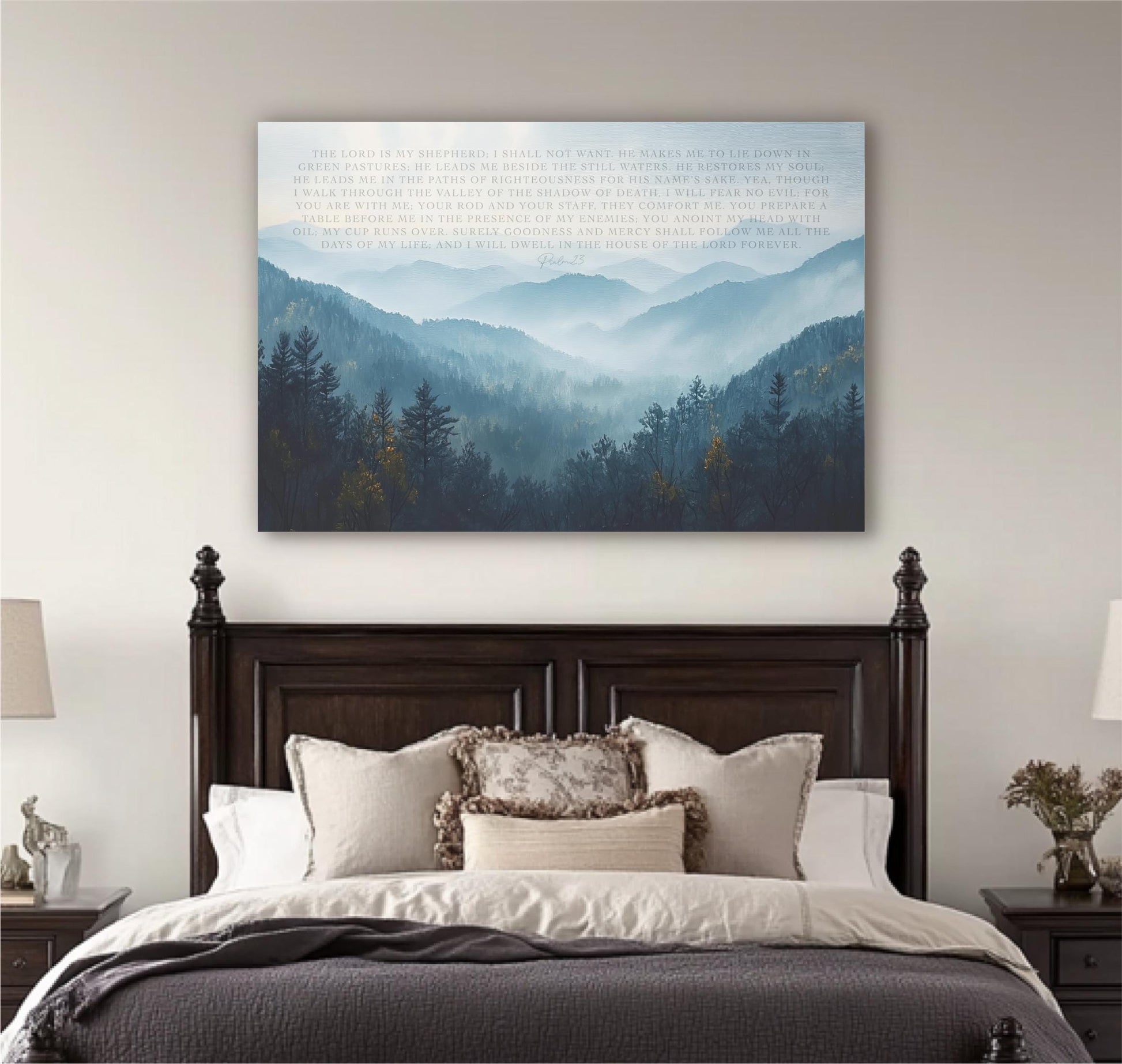 a large bedroom with a wooden headboard and a bed with white bedding. Above the bed, there is a large canvas print depicting a mountain landscape with trees and mountains in the background.