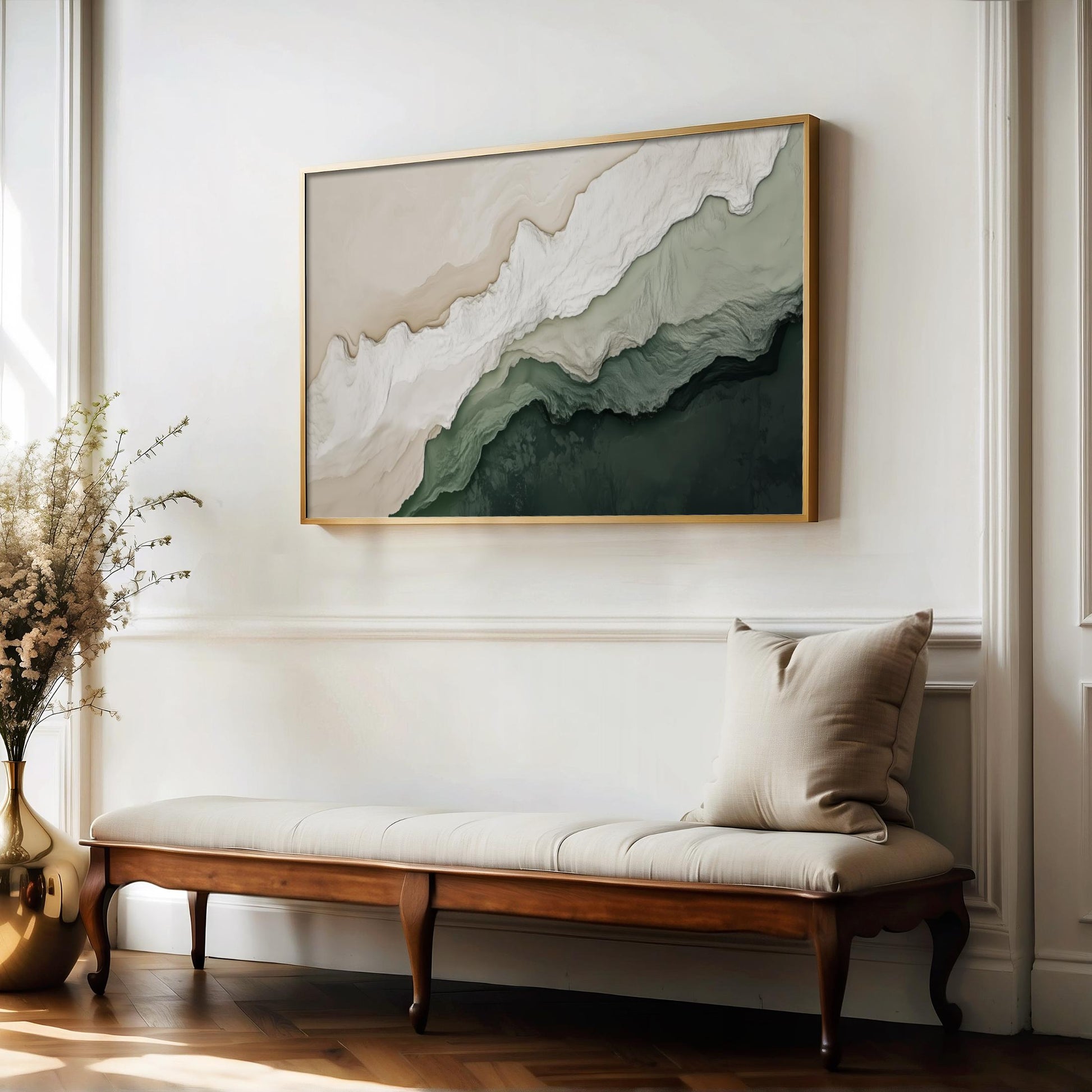 a large abstract painting hanging on a white wall above a wooden bench with a beige cushion.