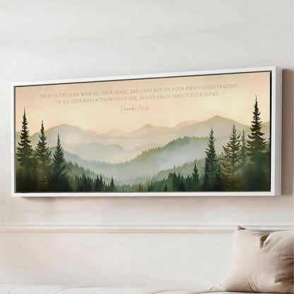 The image is a framed artwork depicting a serene mountain landscape with pine trees and a text overlay that reads "Trust in the Lord with all your heart, and lean not on your own understanding in all your ways acknowledging Him, and he shall direct your paths."