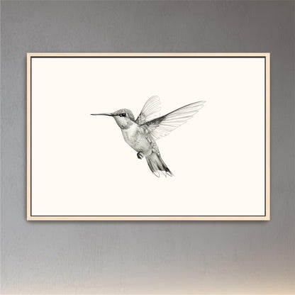 a black and white photo of a hummingbird in flight