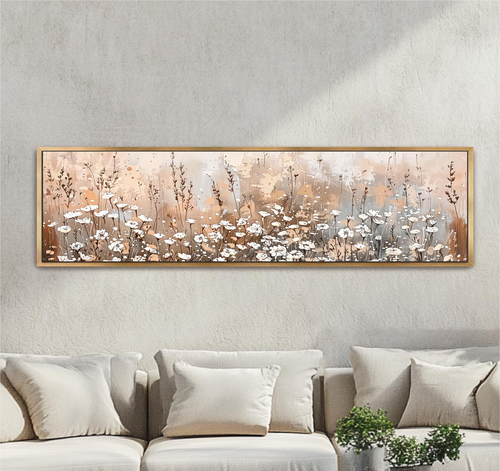 a large, framed painting of a field of flowers hanging on a wall above a couch in a living room setting.