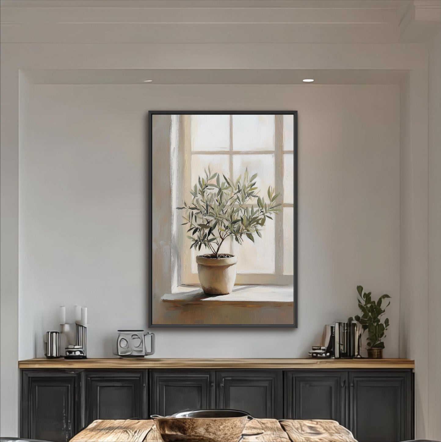 a large painting of a potted plant hanging on a wall above a wooden table with a bowl on it.