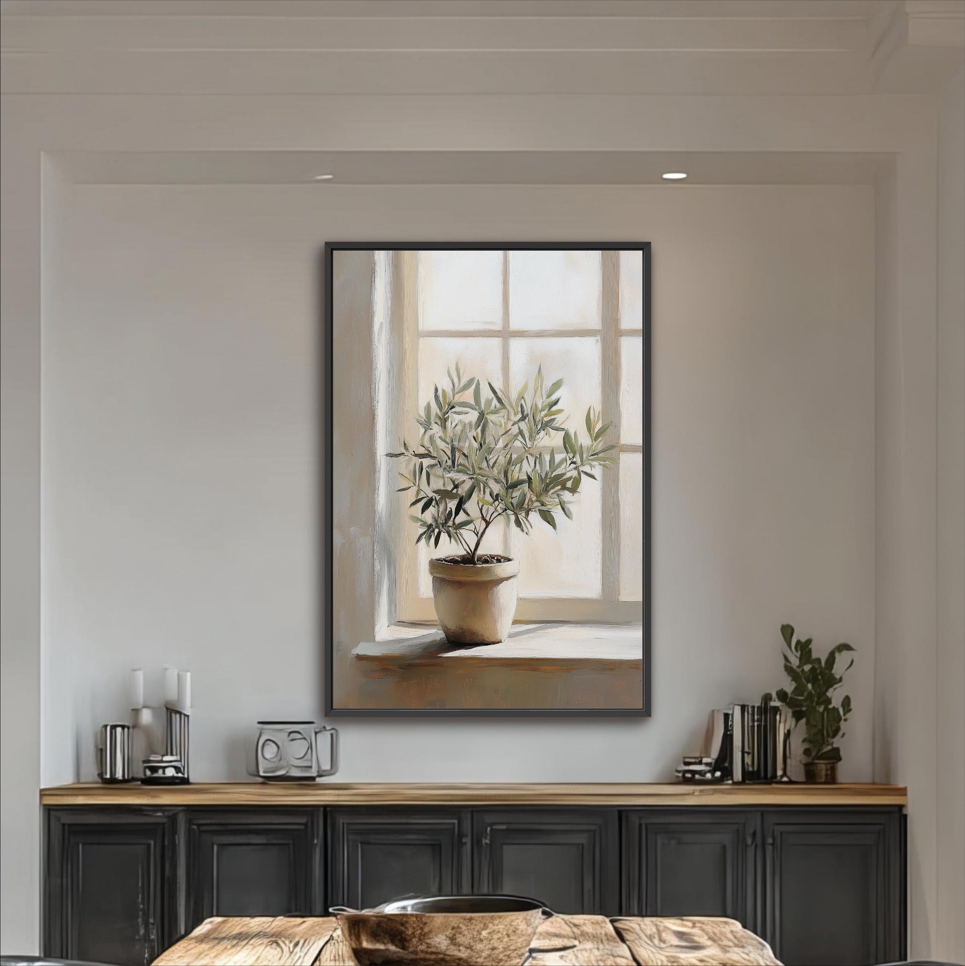 a large painting of a potted plant hanging on a wall above a wooden table with a bowl on it.