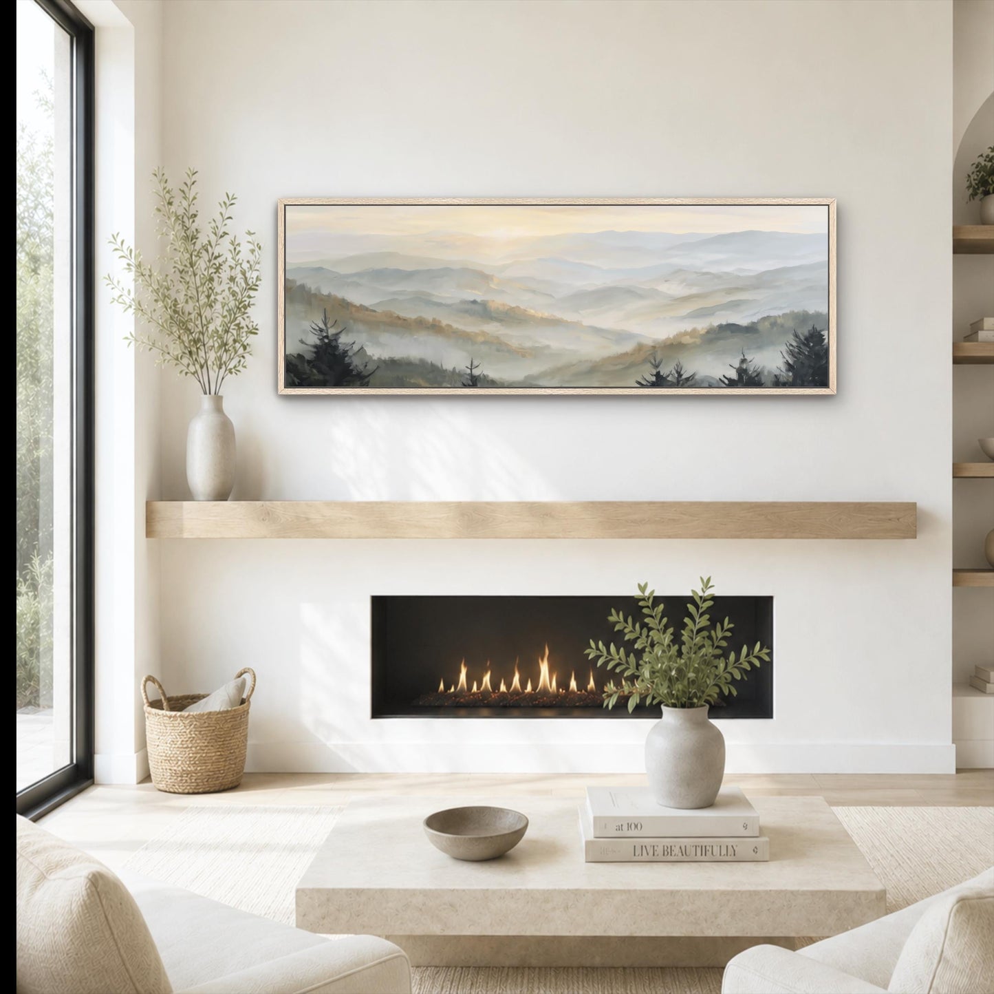 a cozy living room with a fireplace, a coffee table, and a painting of a mountain landscape hanging on the wall above the fireplace.