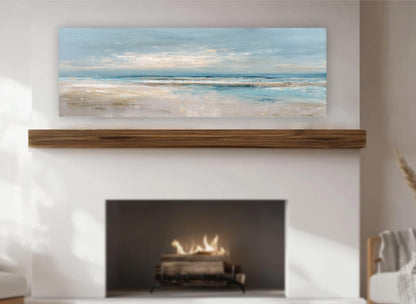 a fireplace with a warm fire burning inside, and above it is a large painting depicting a serene landscape with a blue sky and ocean.