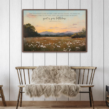 a wooden bench with a furry blanket draped over it, set against a serene landscape of a field with white flowers and a sunset in the background. Above the bench, there is a framed painting depicting a pastoral scene with mountains in the distance.