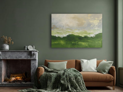 a cozy living room with a fireplace, a brown sofa with green throw pillows, and a large abstract painting of a green landscape hanging on the wall above the sofa.