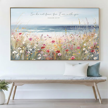 a large, colorful painting of a field of flowers hanging on a wall above a wooden bench.