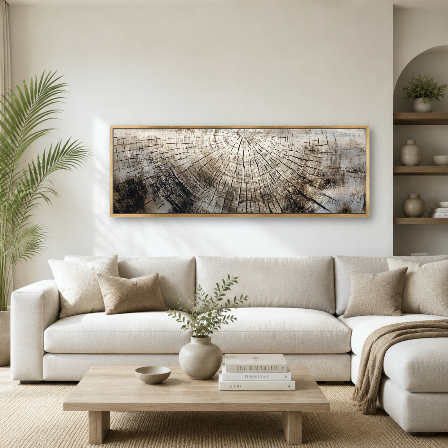 a modern living room with a large, white sectional sofa, a wooden coffee table, and a framed artwork featuring a tree stump design on the wall.