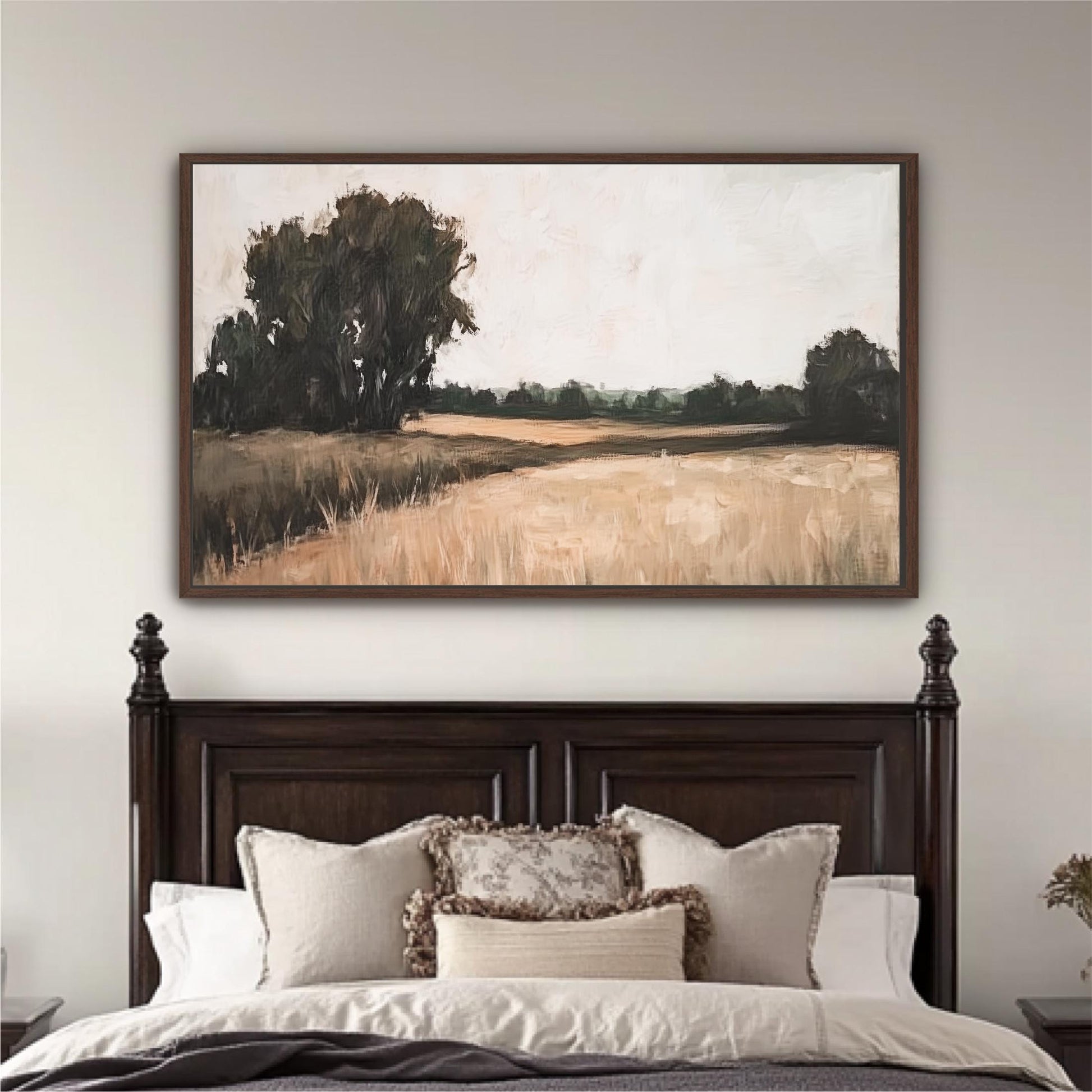 a large painting of a field with trees hanging above a bed with white bedding and pillows.