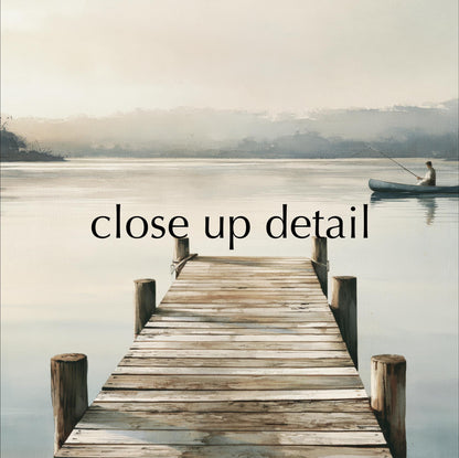 a wooden dock extending into a calm lake, with a person in a boat on the water.