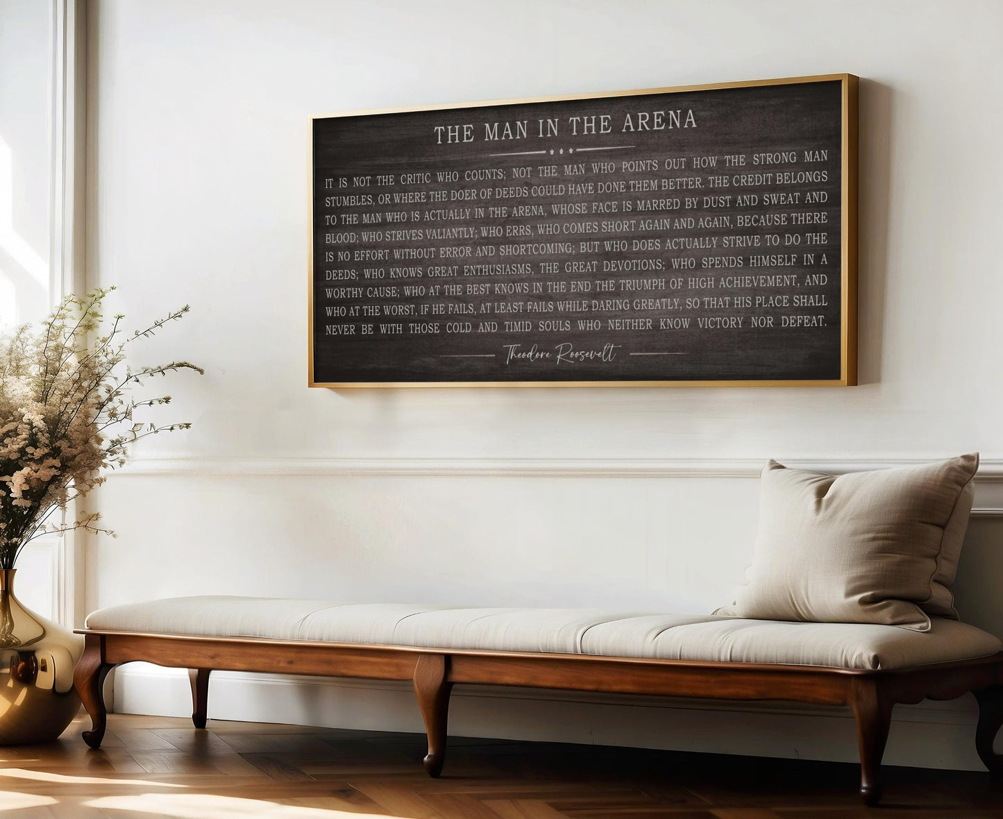 a wooden bench sitting in front of a wall with a poem on it