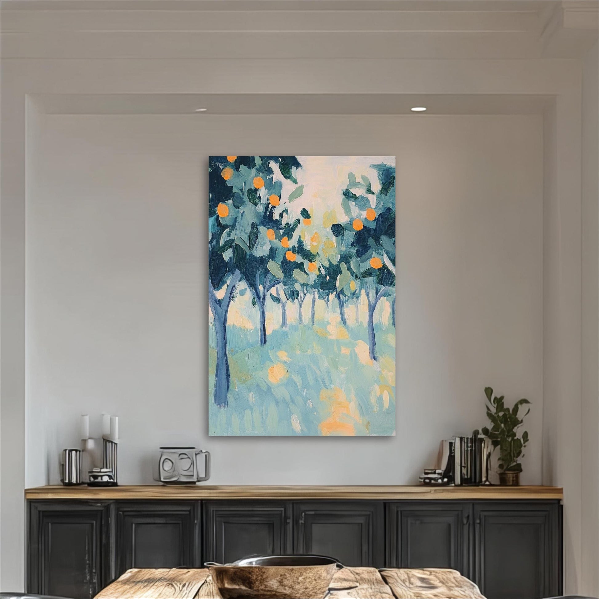 a large abstract painting of a tree-filled landscape hanging on a white wall above a wooden table with a black cabinet below it.