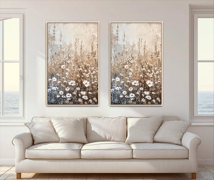 a living room with a white sofa and two framed paintings of flowers hanging on the wall above it.