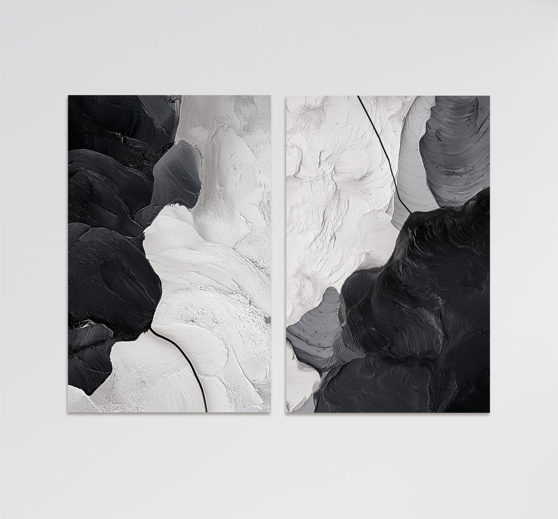 The image is a black and white abstract artwork consisting of two distinct sections, each with its own unique texture and color scheme. The left section features a smooth, white surface with a subtle black line running through it, while the right section has a rough, black surface with a more pronounced black line. The overall composition creates a sense of contrast and balance between the two sections.