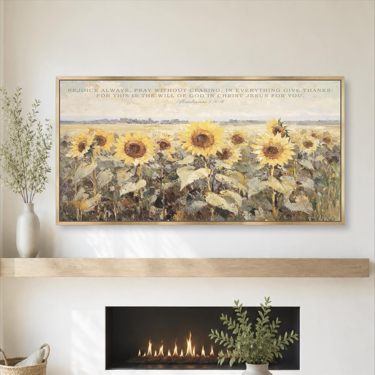 a large painting of a field of sunflowers above a fireplace, with a quote from the Bible above the painting.