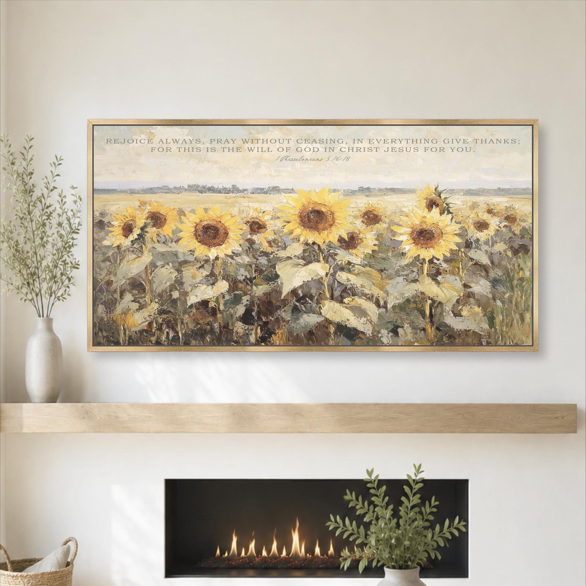 a large painting of a field of sunflowers above a fireplace, with a quote from the Bible above the painting.