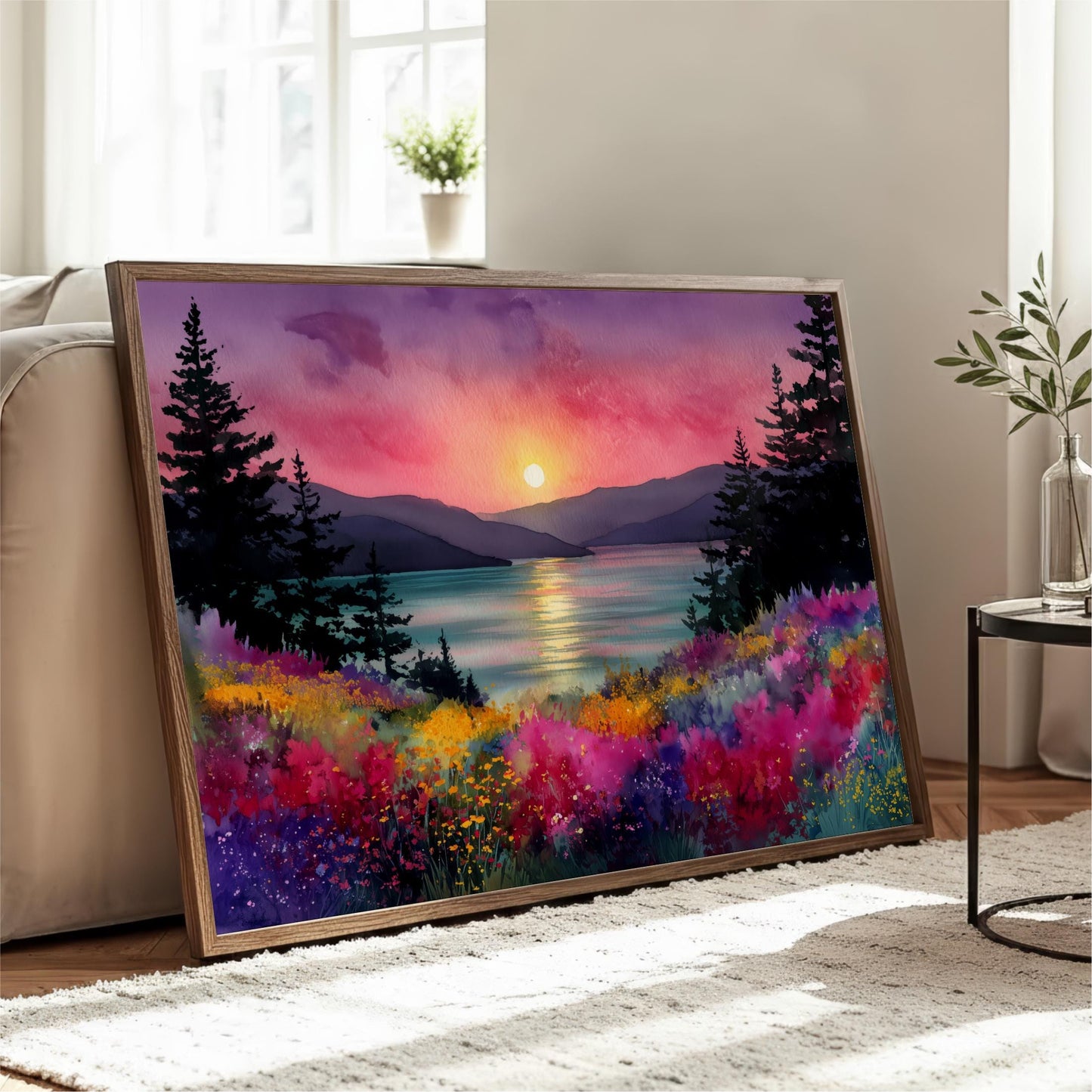 A large framed painting depicting a serene landscape with a sunset over a mountain range, surrounded by colorful flowers and trees.