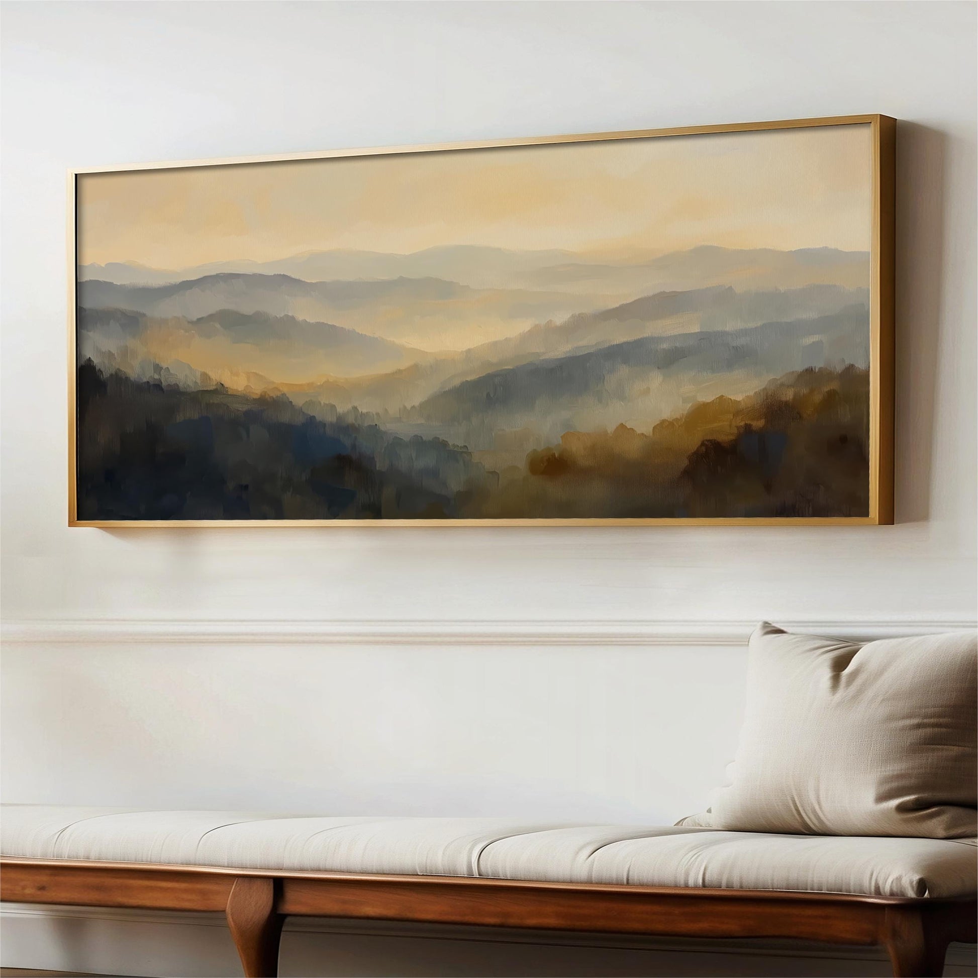a large landscape painting hanging on a wall above a wooden bench.