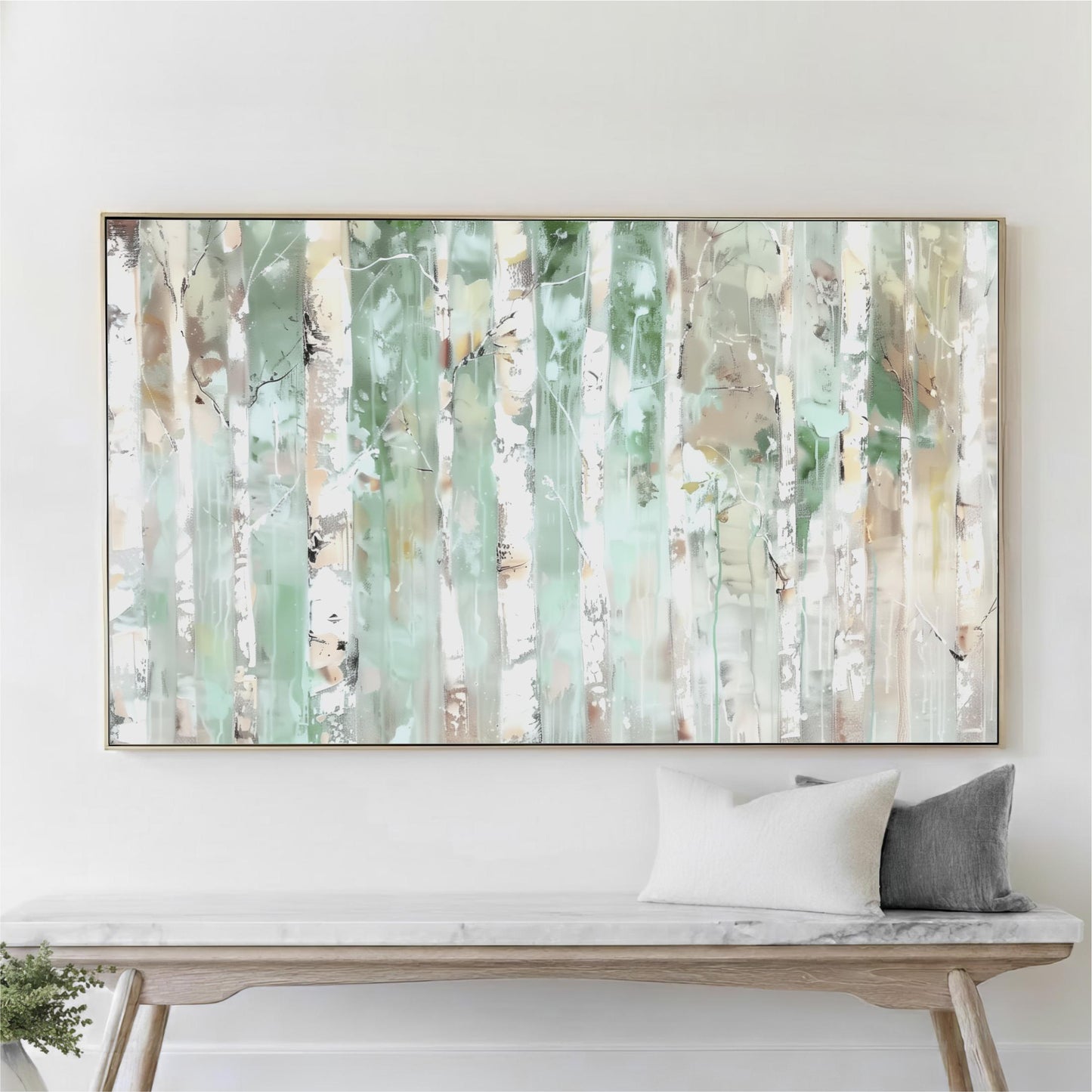 a large abstract painting hanging on a white wall above a wooden bench with two pillows.