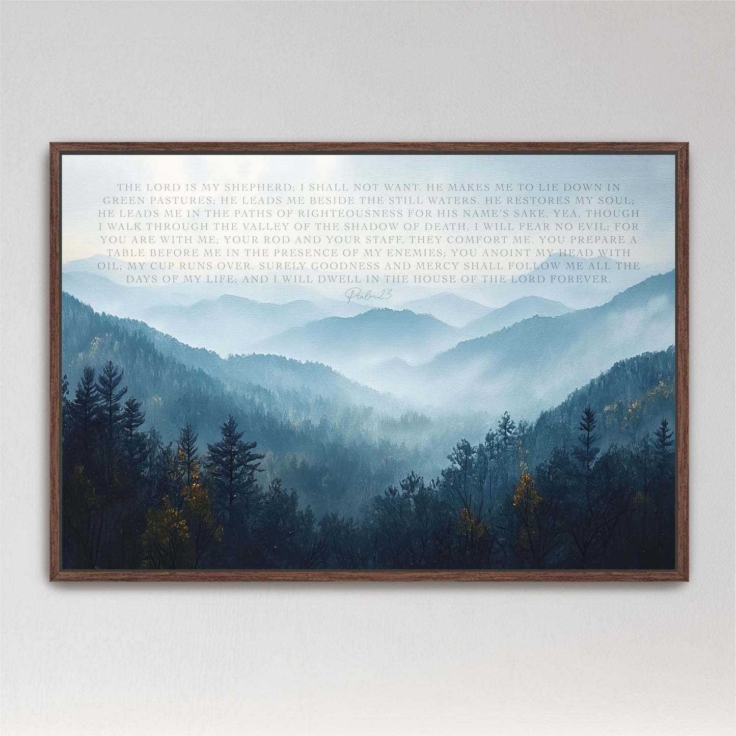 The image is a framed print of a serene mountain landscape with a misty, hazy atmosphere. The mountains are covered in trees and shrubs, creating a sense of depth and tranquility. The text in the image appears to be a biblical passage from the book of Proverbs, providing a spiritual and inspirational backdrop to the natural scene.