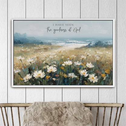 The image is a framed painting depicting a field of white flowers against a backdrop of a blue sky and a body of water.