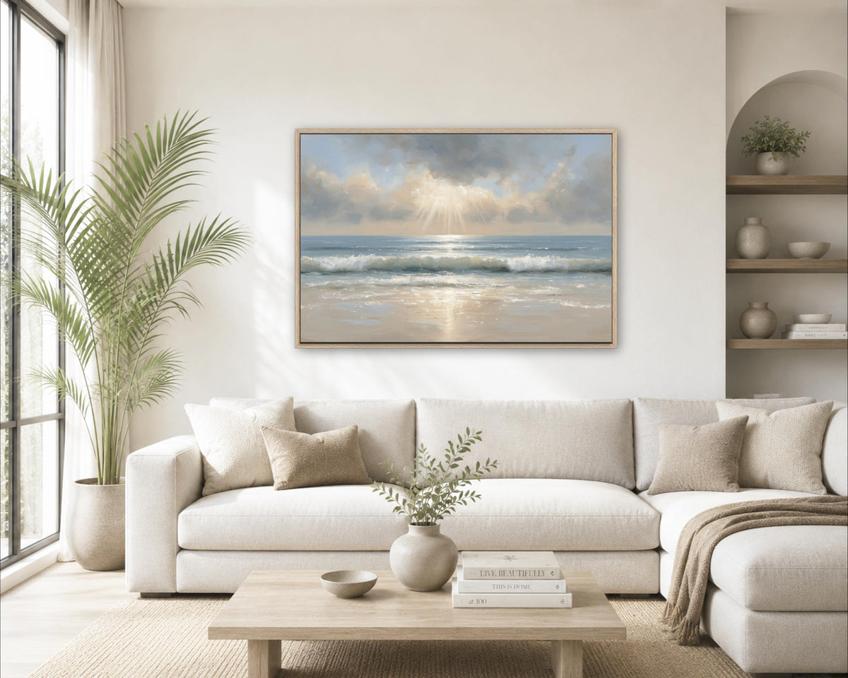 a serene living room with a large window overlooking a beach, a white sofa, a wooden coffee table, and a framed painting of a beach scene hanging on the wall.